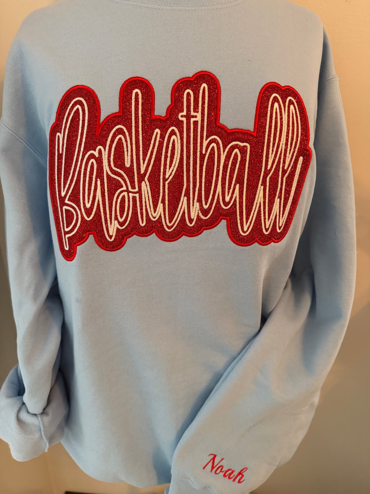 Embroidered "Basketball" red glitter applique with custom name on sleeve